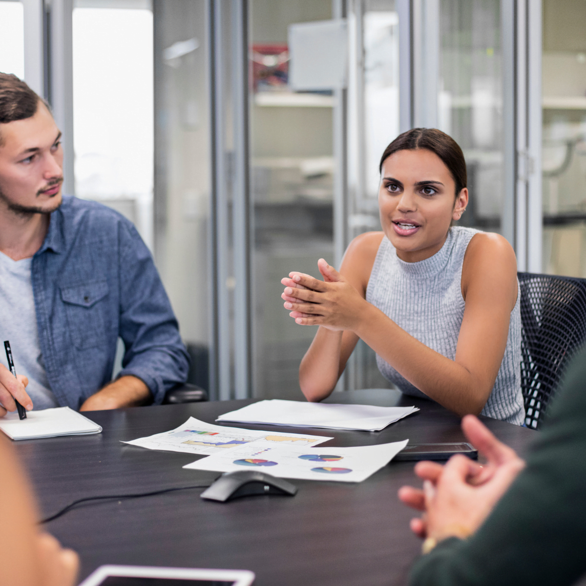 Female business manager leading business meeting in office